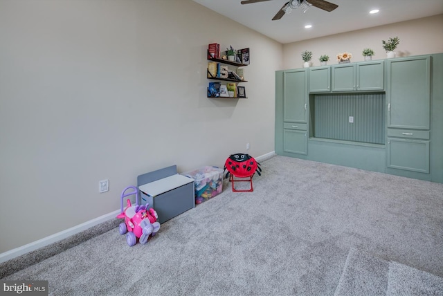 rec room with ceiling fan and carpet floors