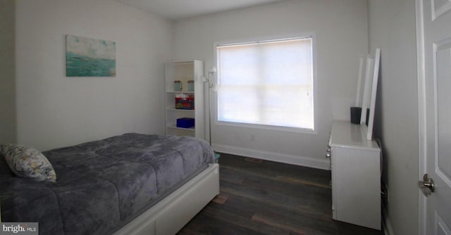 bedroom featuring dark hardwood / wood-style flooring