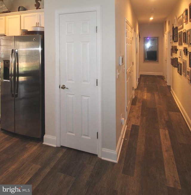 corridor featuring dark hardwood / wood-style flooring