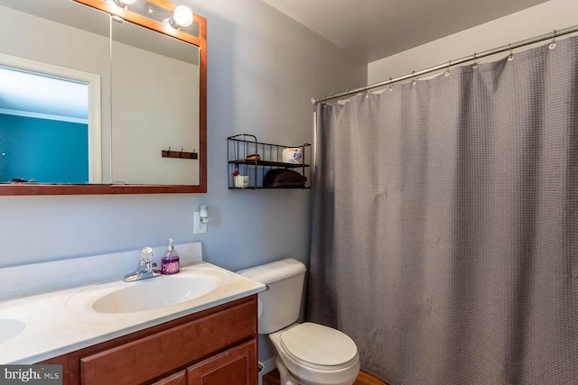 bathroom featuring vanity and toilet