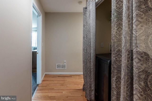 hall featuring light hardwood / wood-style flooring