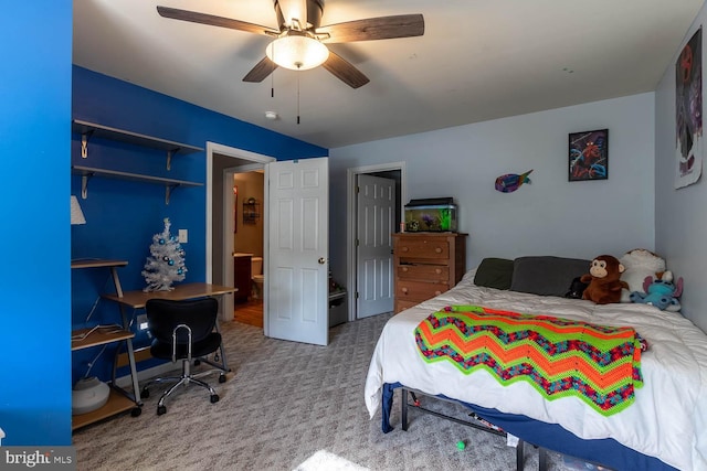 bedroom featuring ceiling fan, a closet, and light colored carpet