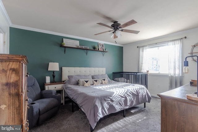 carpeted bedroom with ceiling fan and crown molding