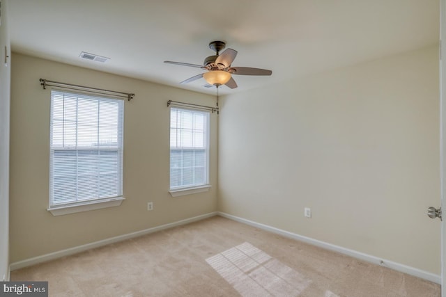 carpeted empty room with ceiling fan