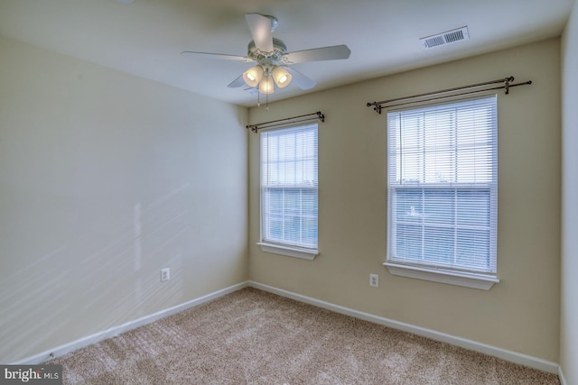 carpeted empty room with ceiling fan