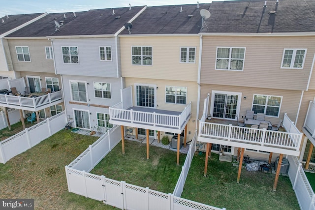 rear view of house featuring cooling unit