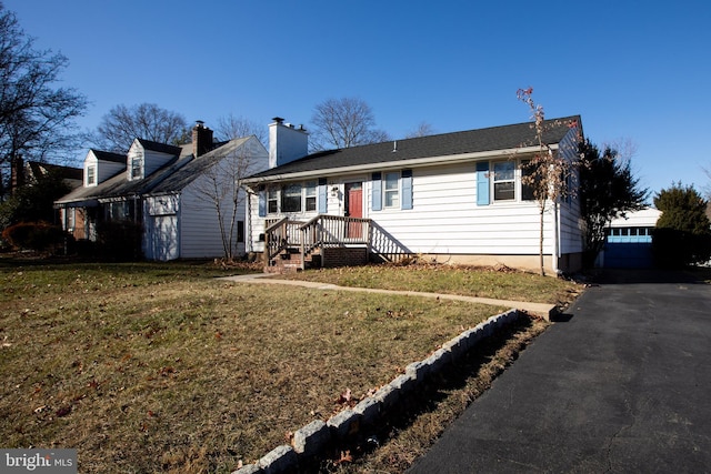 ranch-style house with a front lawn