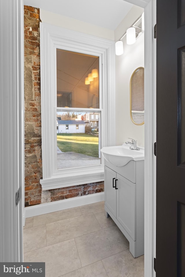 bathroom featuring tile patterned flooring and vanity