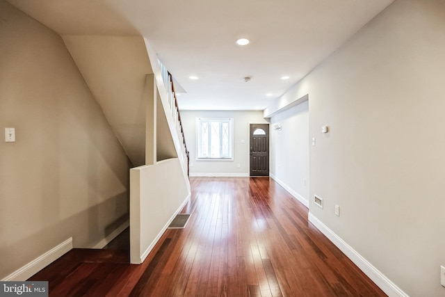 hallway featuring dark hardwood / wood-style flooring