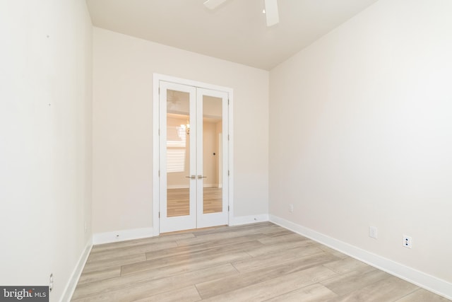 unfurnished room featuring french doors, baseboards, light wood-style floors, and a ceiling fan