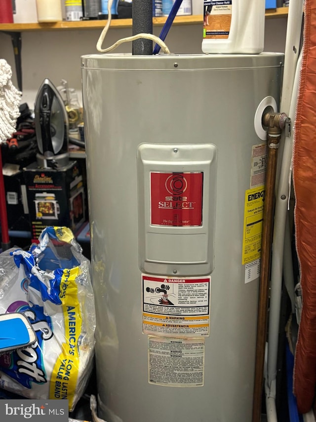 utility room featuring water heater