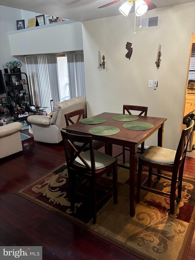 dining room with hardwood / wood-style floors and ceiling fan