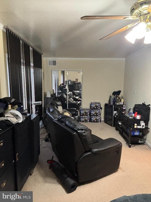 carpeted living room with ceiling fan