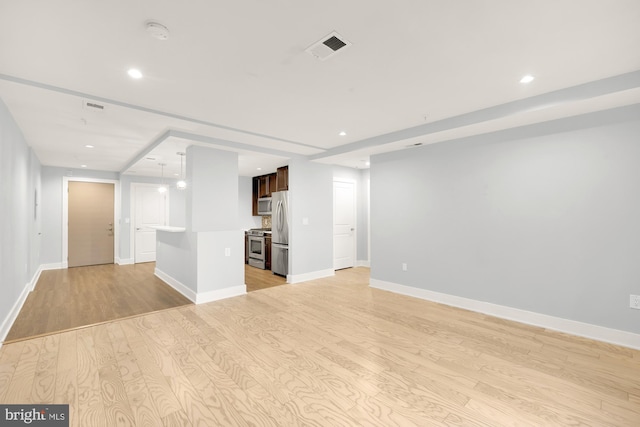 unfurnished living room featuring light wood-type flooring