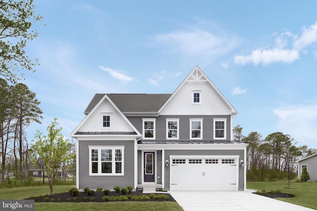 view of front of property with a front lawn and a garage