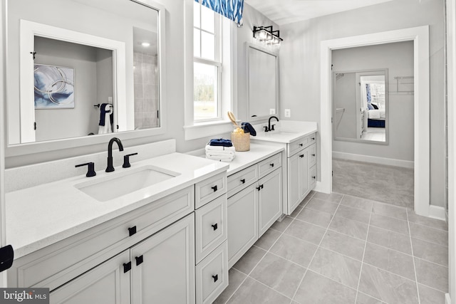 bathroom featuring tile patterned flooring and vanity