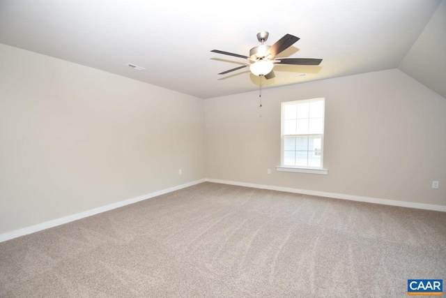 additional living space with carpet floors, vaulted ceiling, and ceiling fan