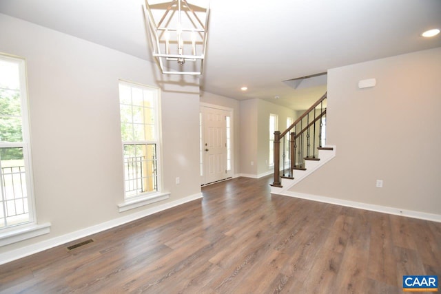 foyer with dark hardwood / wood-style flooring