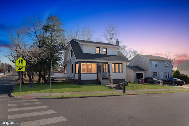 view of front of home with a lawn