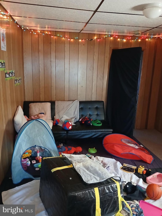 bedroom with wood walls