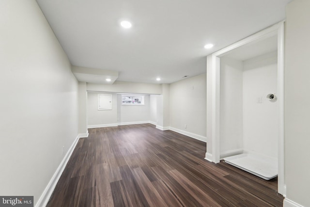 basement with dark wood-type flooring