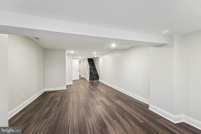 basement featuring dark hardwood / wood-style flooring