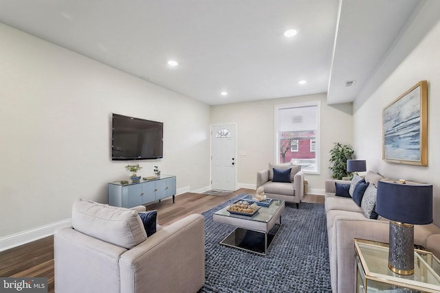 living room featuring dark hardwood / wood-style flooring