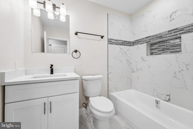 full bathroom with vanity, tiled shower / bath combo, and toilet