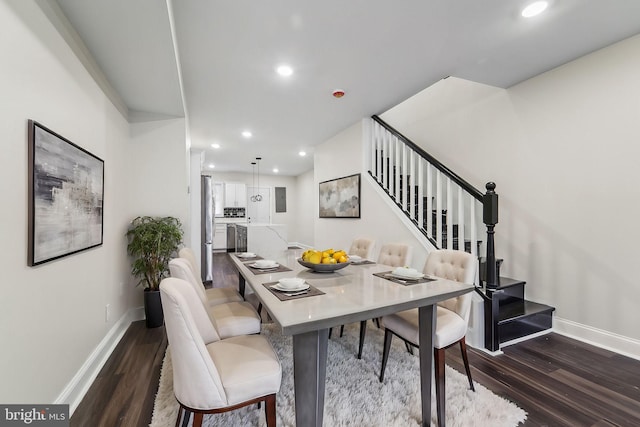 dining area with dark hardwood / wood-style flooring