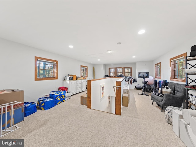 game room featuring plenty of natural light and light colored carpet