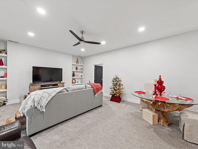 living room with ceiling fan and light colored carpet