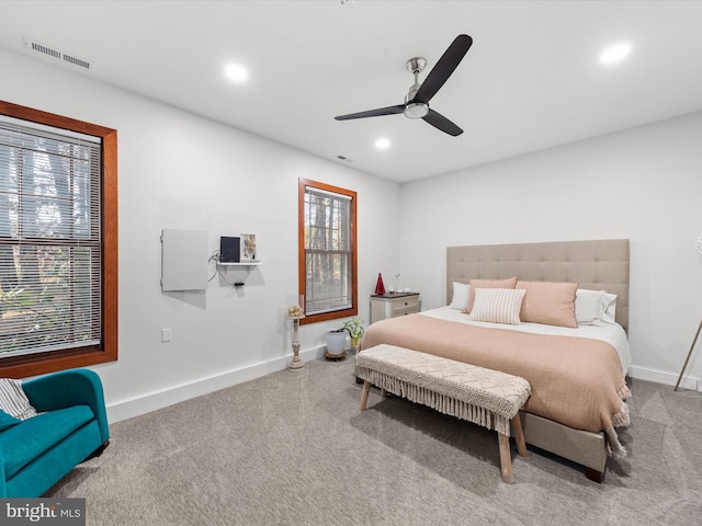 carpeted bedroom featuring ceiling fan