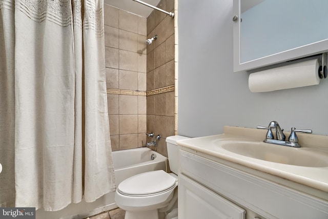 full bathroom featuring shower / bath combo with shower curtain, vanity, and toilet