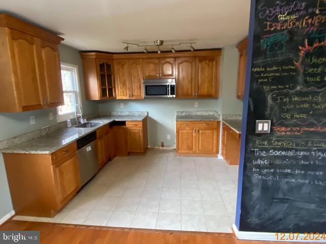 kitchen with sink and appliances with stainless steel finishes