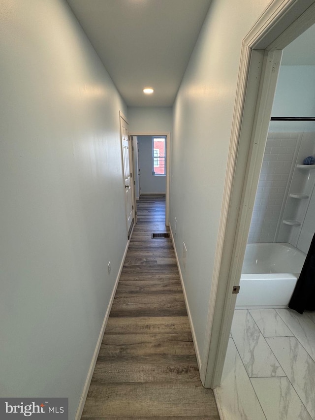 hallway featuring hardwood / wood-style floors