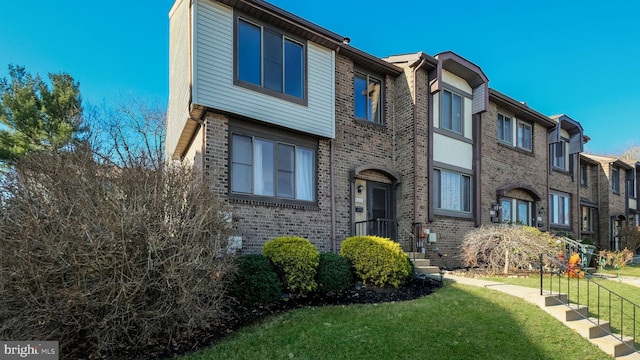 exterior space with a front lawn