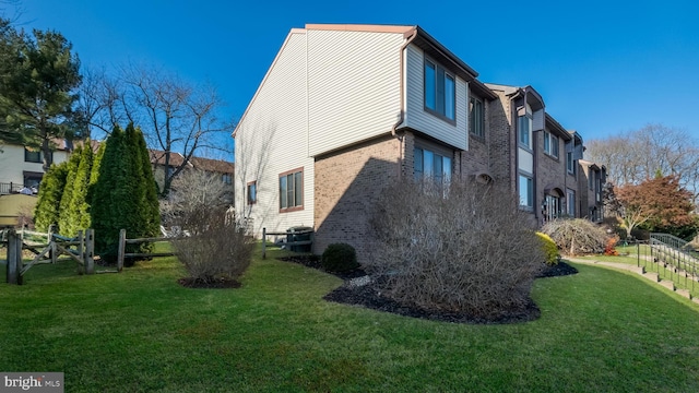 view of home's exterior with a yard