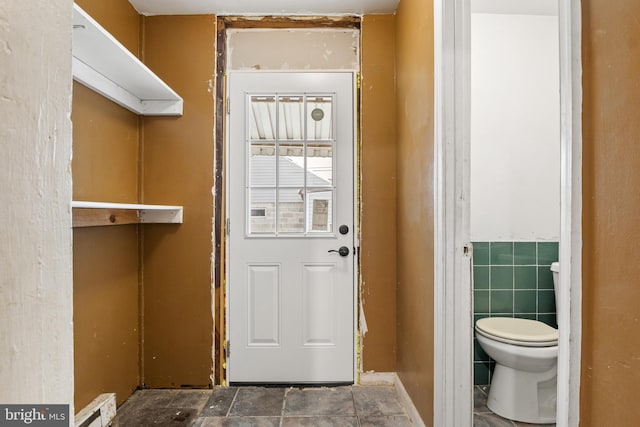 entryway with tile walls