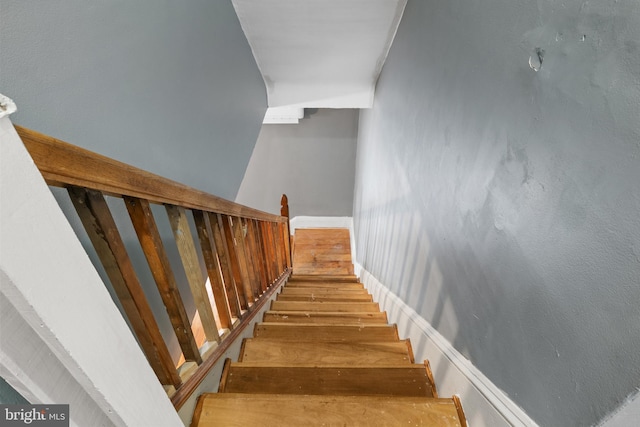 stairs with wood finished floors