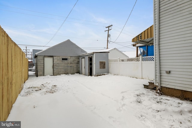 exterior space featuring a shed, an outdoor structure, and a fenced backyard