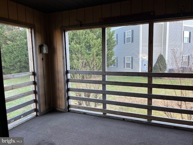 unfurnished sunroom featuring a wealth of natural light