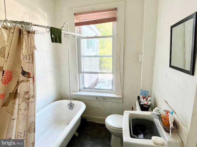 bathroom with sink, tile patterned flooring, and toilet