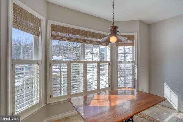 unfurnished dining area with ceiling fan and a wealth of natural light