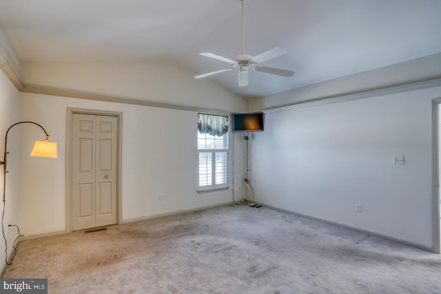 unfurnished room featuring ceiling fan, light colored carpet, and lofted ceiling