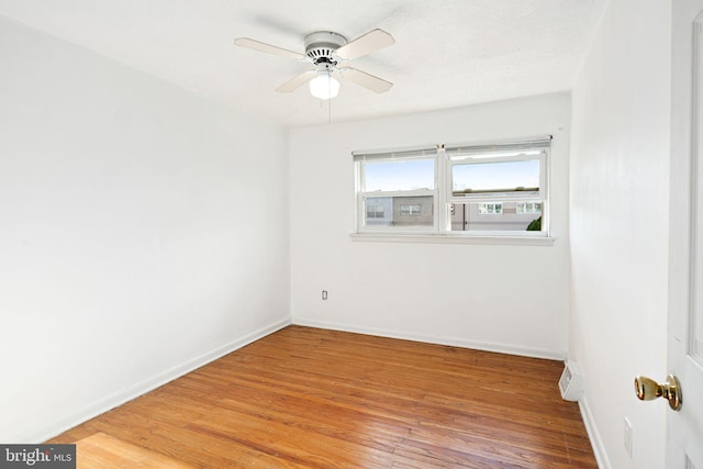 unfurnished room featuring hardwood / wood-style floors and ceiling fan