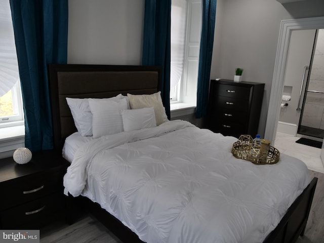 bedroom featuring hardwood / wood-style floors