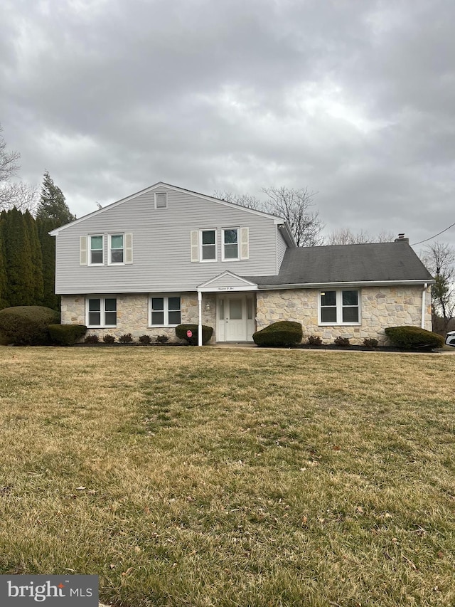 view of front of home with a front yard