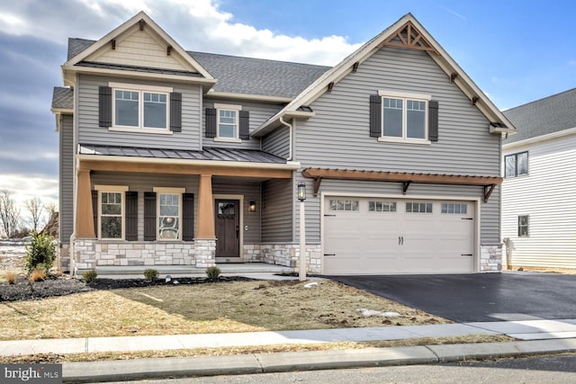 craftsman house featuring a garage and a porch