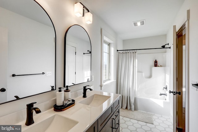 bathroom with vanity and shower / tub combo