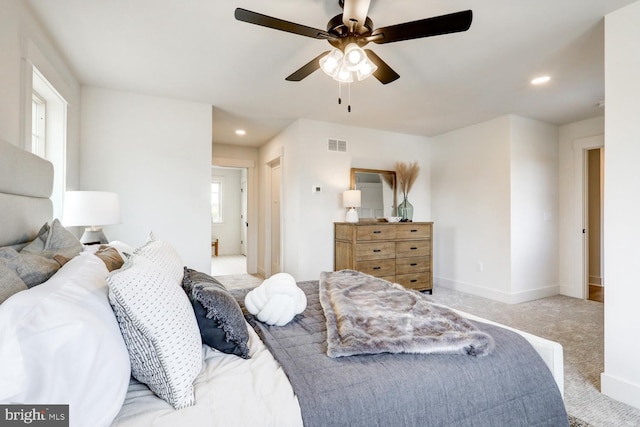 carpeted bedroom with ceiling fan